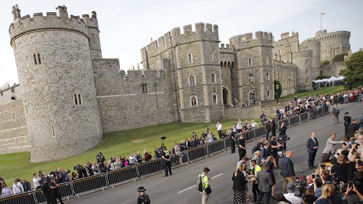 Britain's Prince Harry, center right, reacts as he greets crowds in Windsor, near London, England, Friday, May 18, 2018. Preparations continue in Windsor ahead of the royal wedding of Britain's Prince Harry and Meghan Markle on Saturday May 19. (AP Photo/Emilio Morenatti)